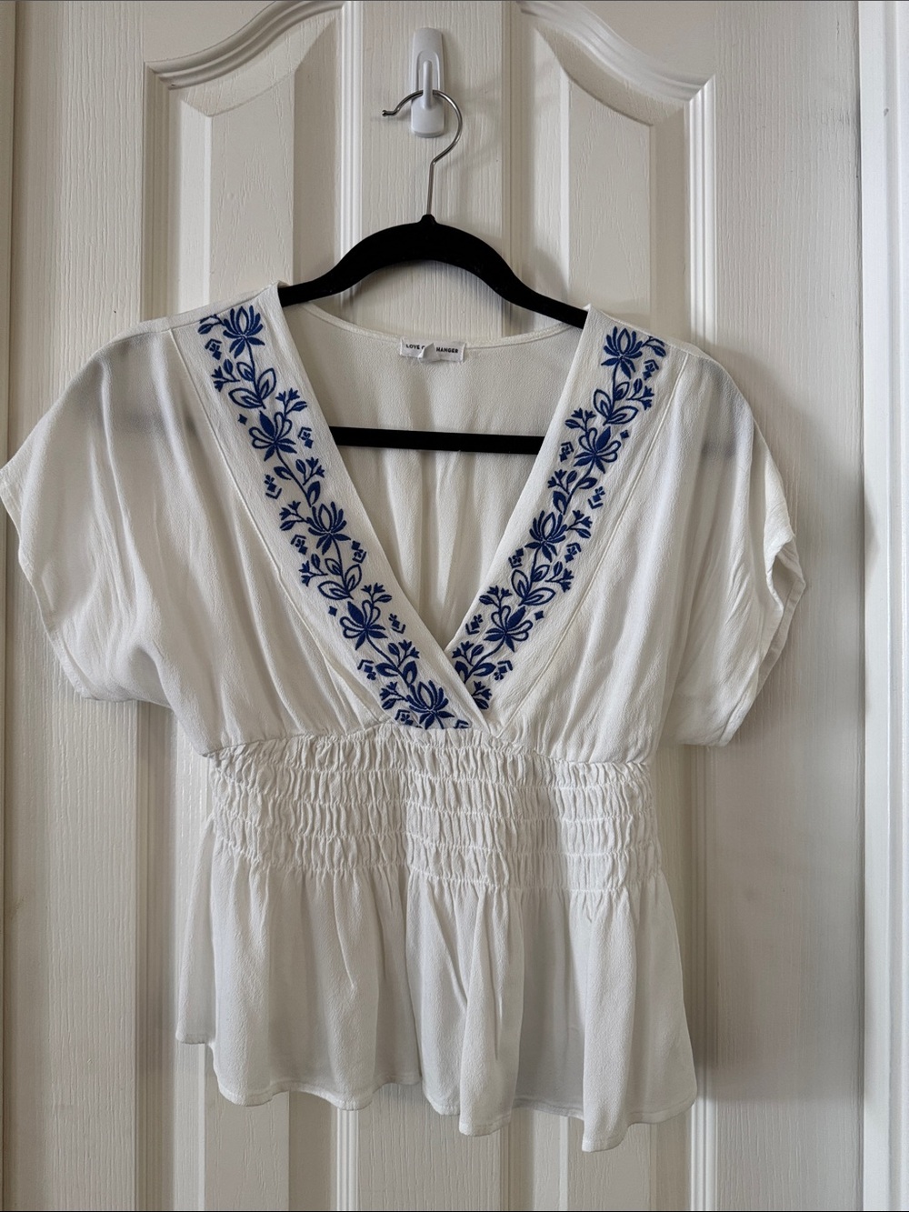 love on a hanger White V-Neck Peplum Top with Blue Embroidery